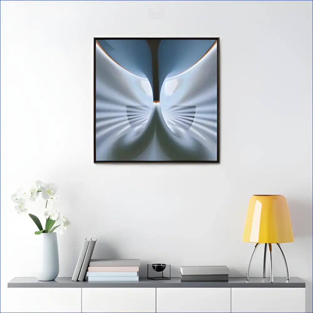 Abstract butterfly-like artwork in soft blue and white tones.