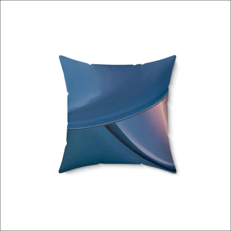 Decorative throw pillow with blue tones and an iridescent curved design.