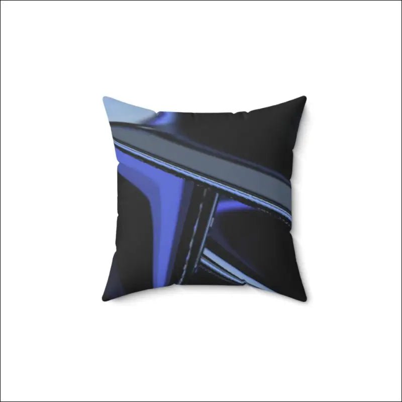 Decorative throw pillow with black and electric blue diagonal abstract design.