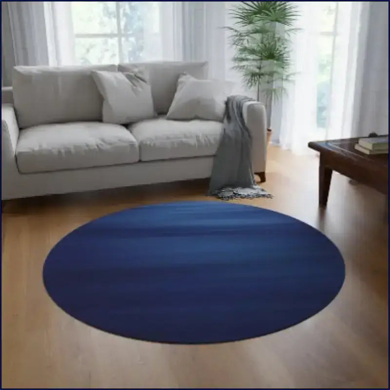 Circular blue rug on a wooden floor.