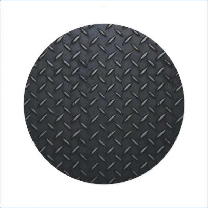 Circular piece of black diamond plate metal with a raised tread pattern.