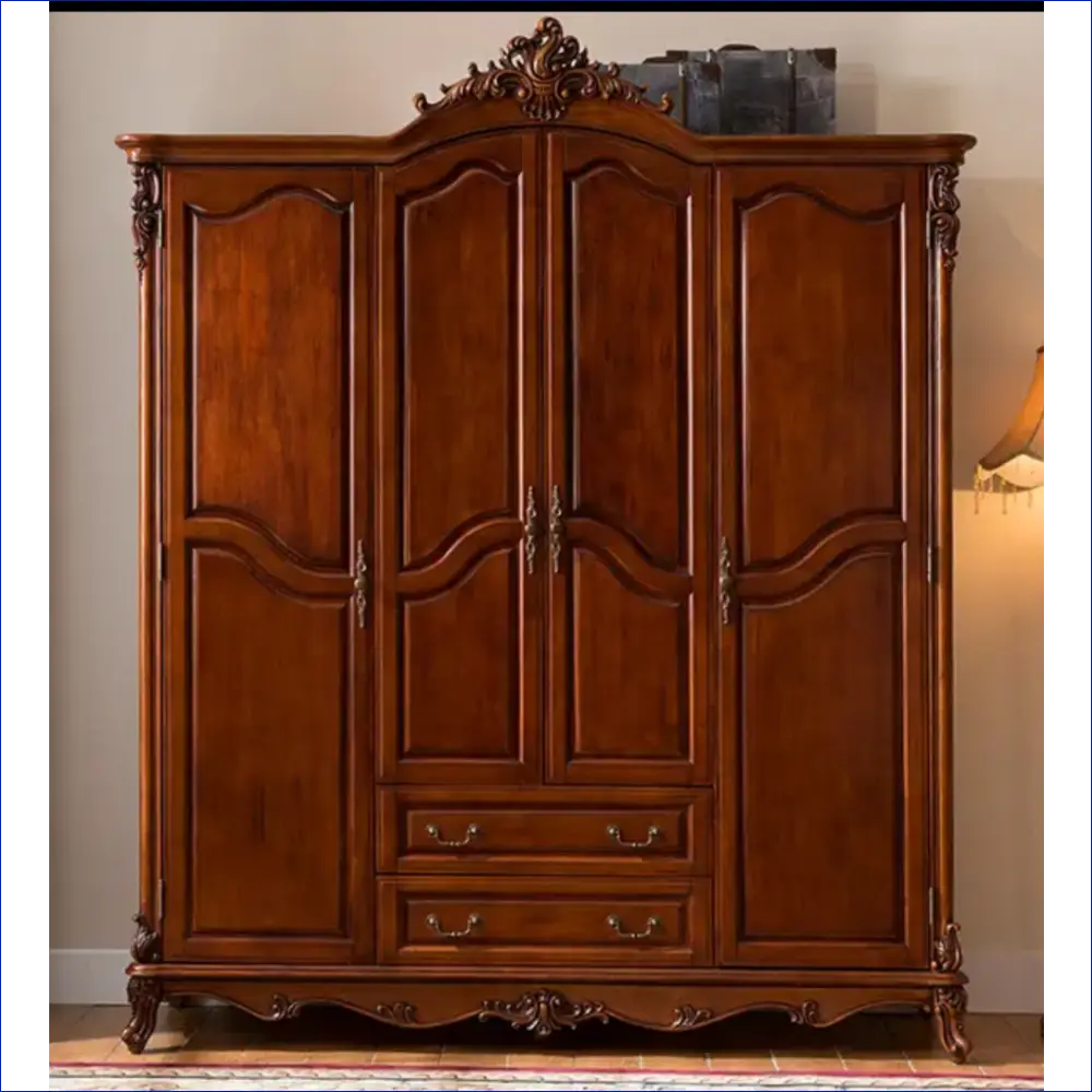 Ornate wooden armoire with carved details, four doors, and two drawers.