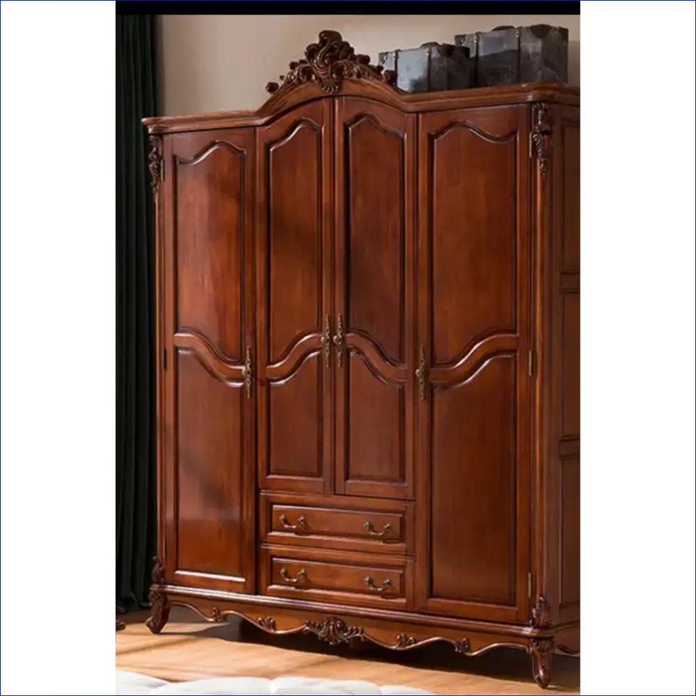 Ornate wooden armoire with carved details, four doors and two drawers.