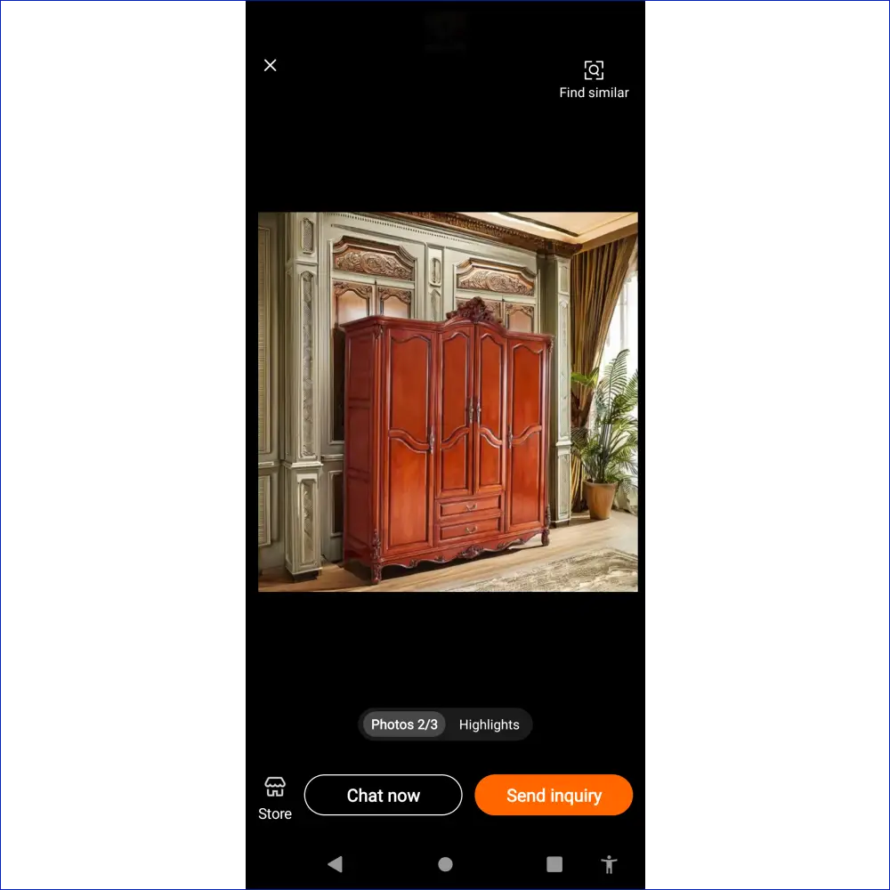 Ornate reddish-brown wooden wardrobe with decorative carved details and double doors.