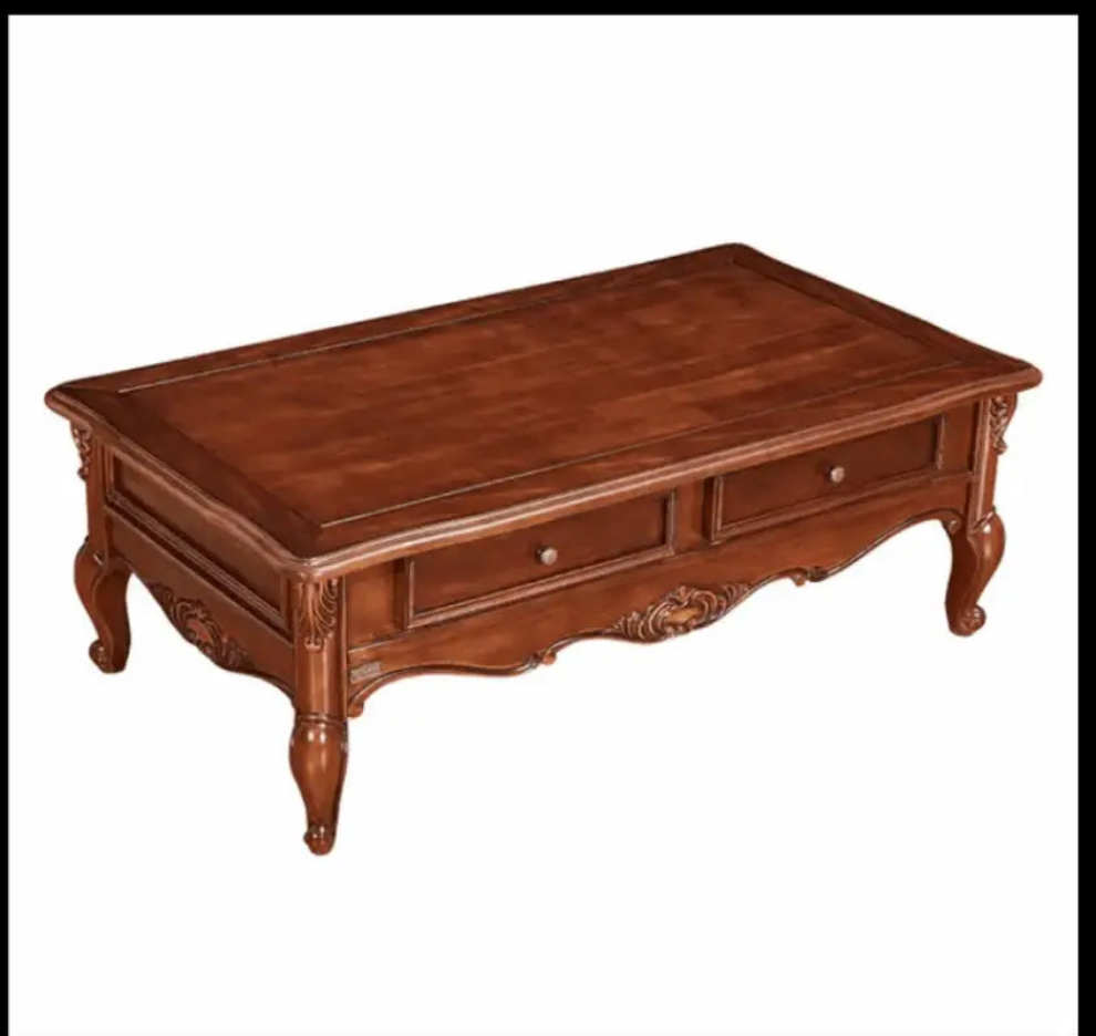 Ornate wooden coffee table with two drawers and curved legs.