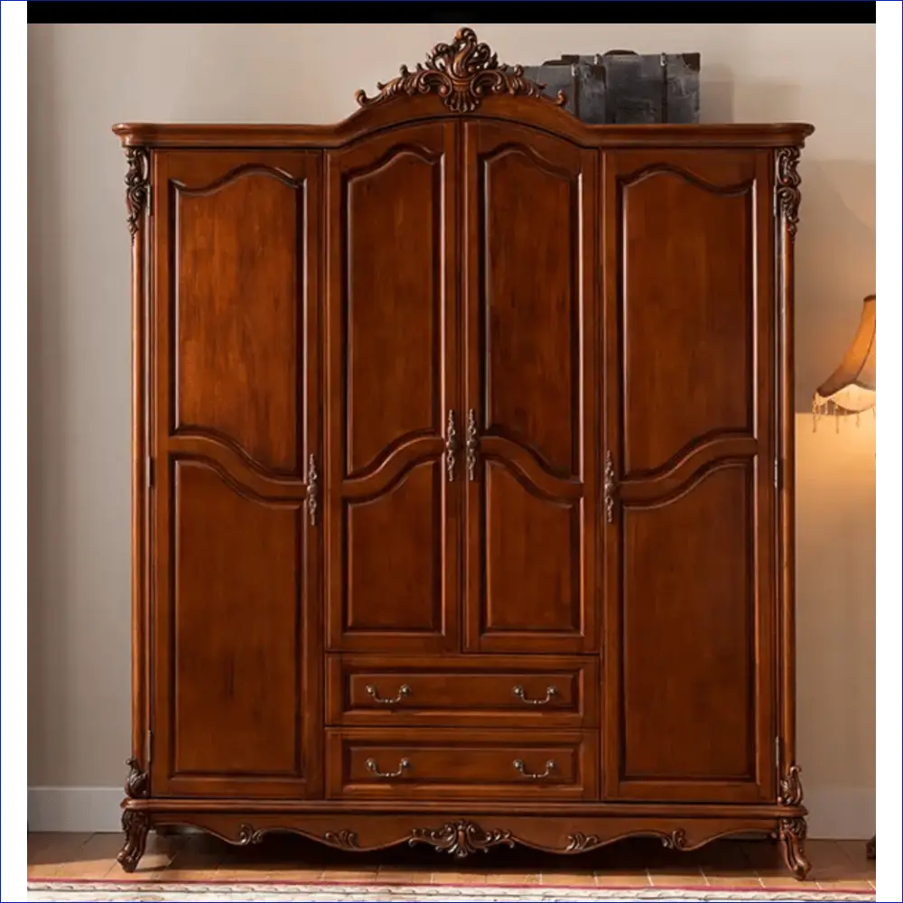 Ornate wooden armoire with carved details, four doors and two drawers.