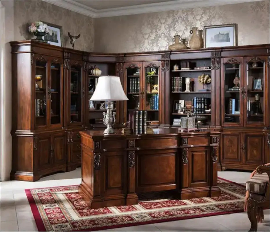 Gorgeous office with sprawling library and large desk and chair