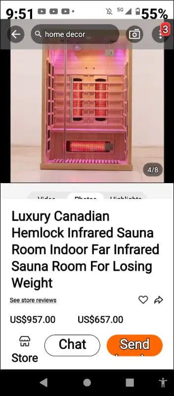 Pink-tinted infrared sauna cabin with multiple wooden bench levels and heating panels.