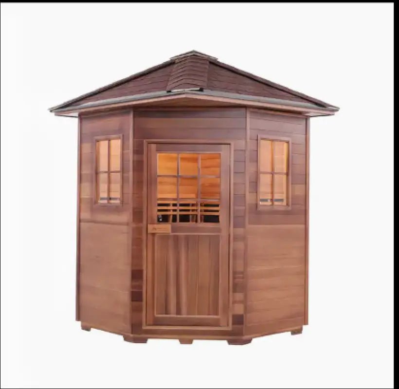 Corner-style outdoor wooden sauna with windows and a door.