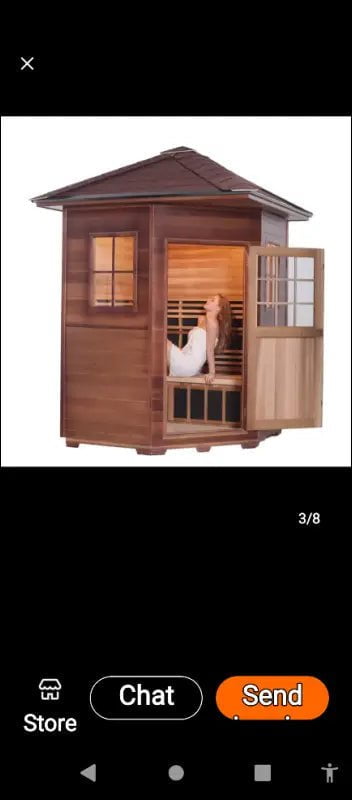 Wooden outdoor sauna cabin with glass door and window.