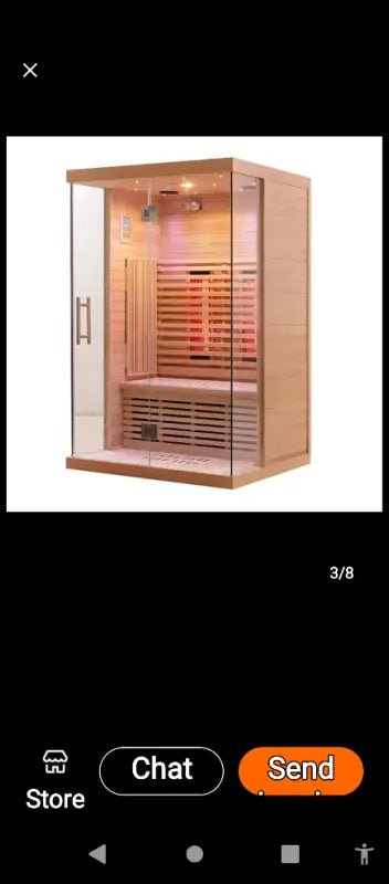 Modern infrared sauna with glass door and wooden interior benches.