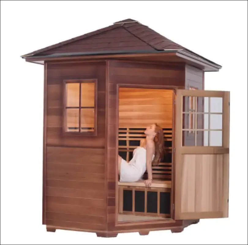 Wooden outdoor sauna cabin with a glass door and window.