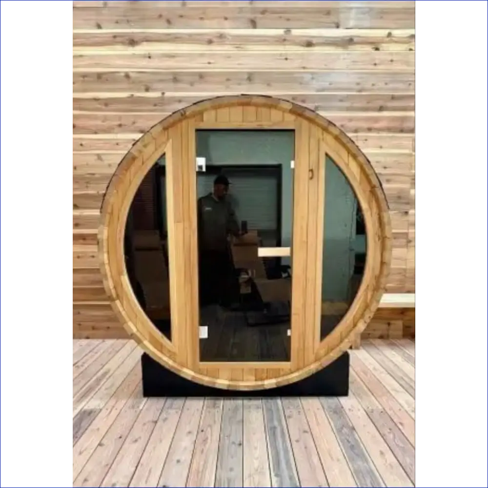 Circular wooden door with glass panels set in a barrel-shaped frame.