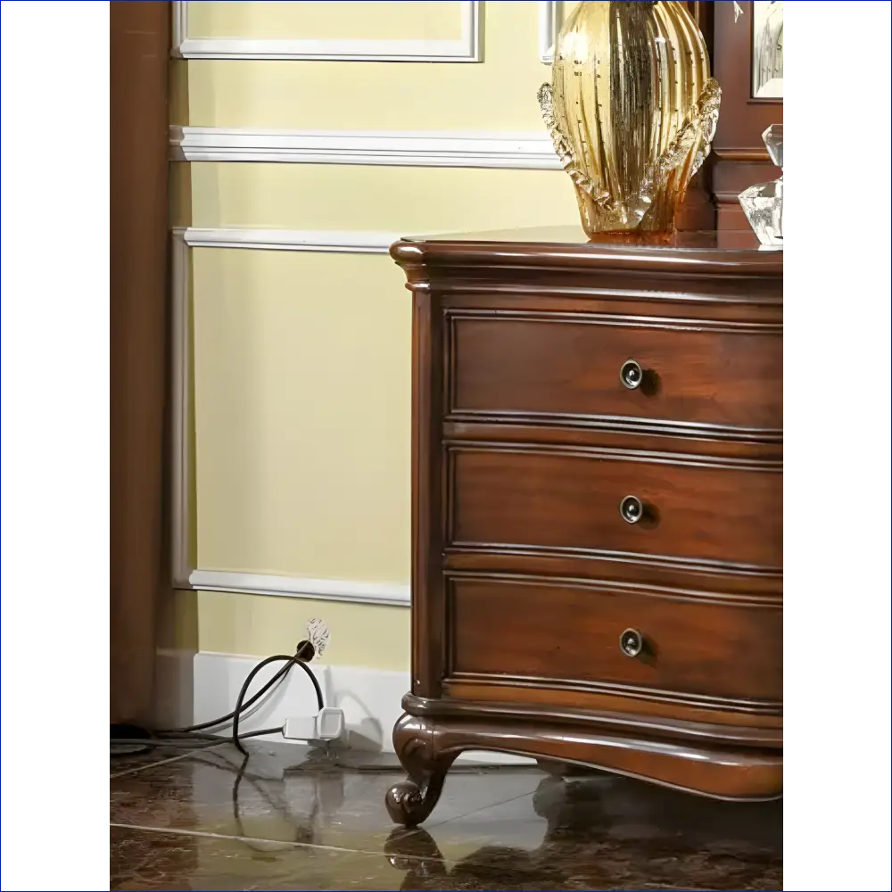 Traditional wooden dresser with curved legs and three drawers.