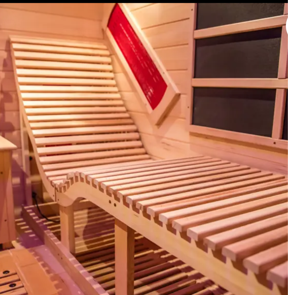 Wooden sauna bench with slatted design.