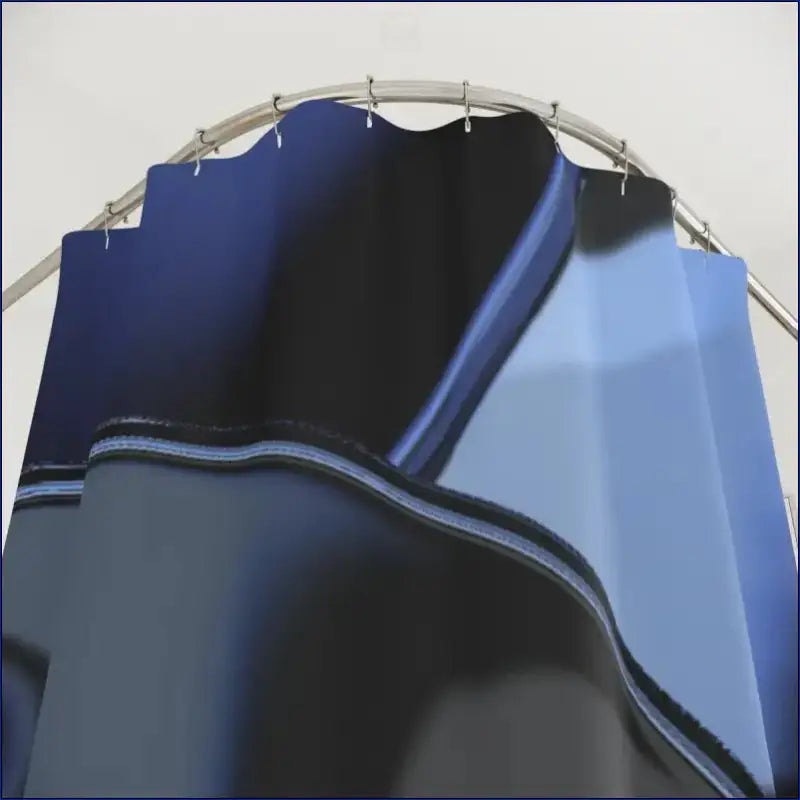 Curved blue metal panel with angular geometric lines and shadows.