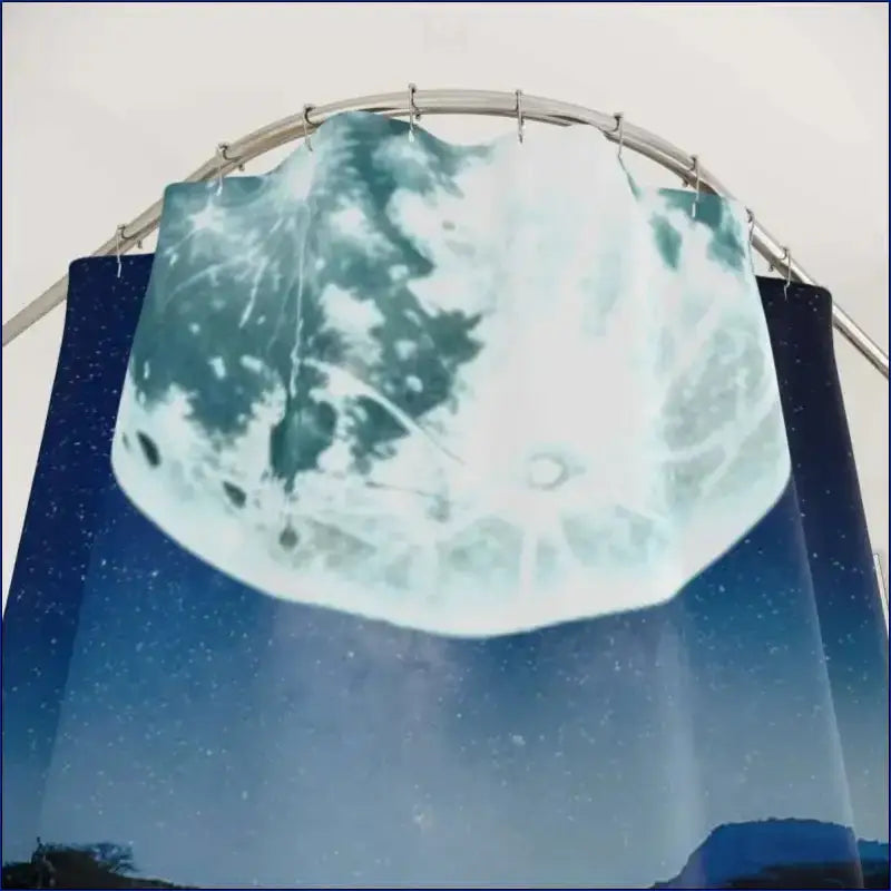 Full moon reflected in a curved mirror against a starry sky.