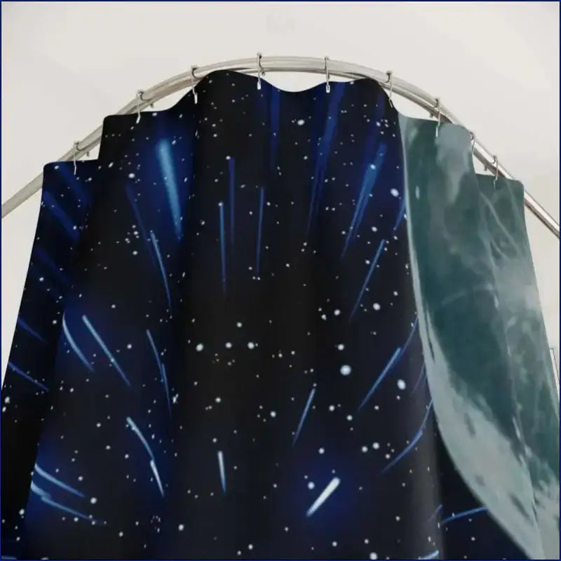 Dark fabric with a starry night sky and shooting star pattern.