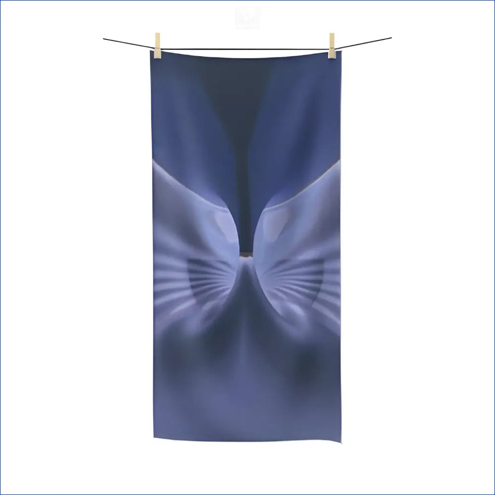 Blue and white butterfly-shaped design hanging from a clothesline.