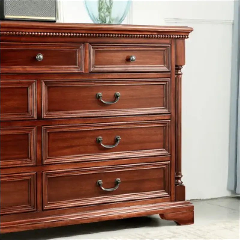 Traditional wooden dresser with multiple drawers and brass hardware.